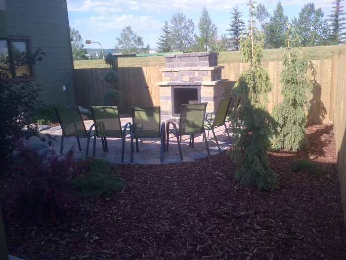 Outdoor brick fireplace in yard